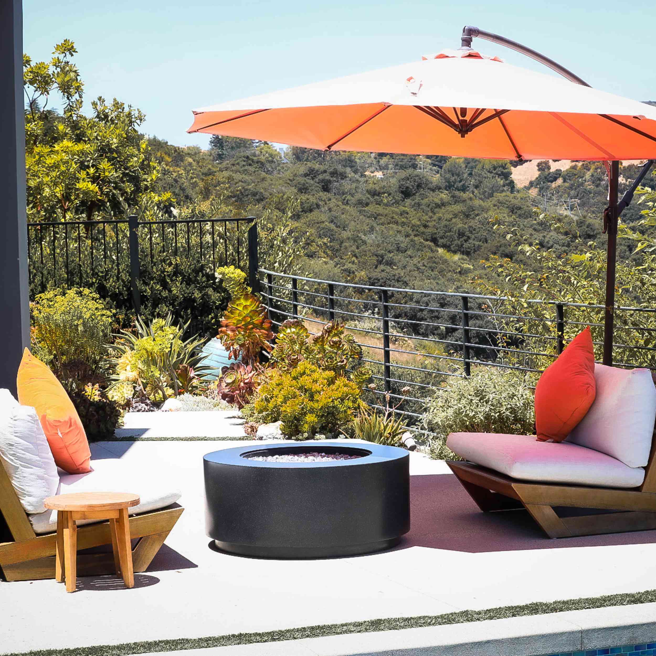 Oblica Black In open area with Orange umbrella