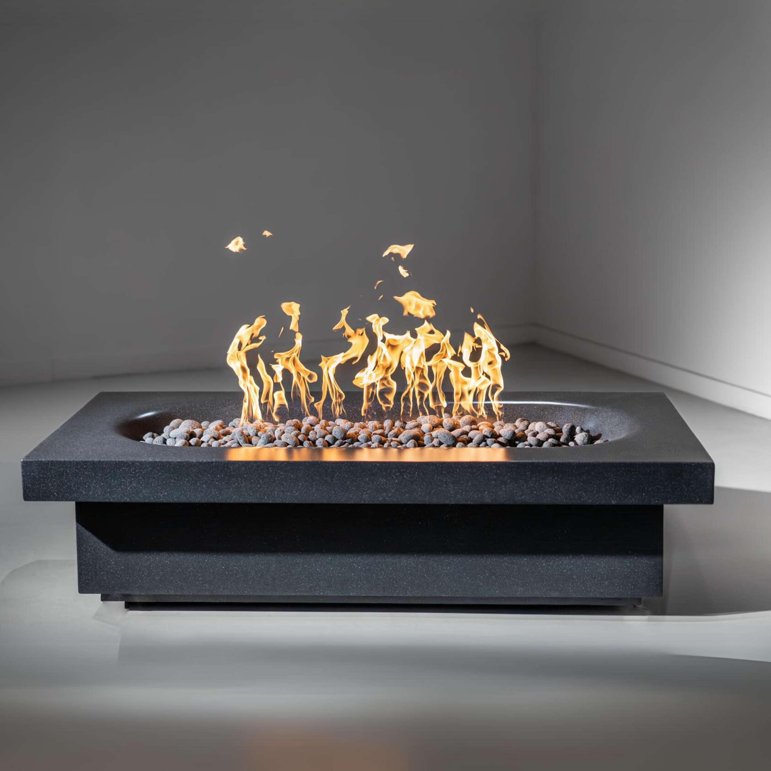 Fortis fire pit by wetstone design - black color rectangular with gas flames lit