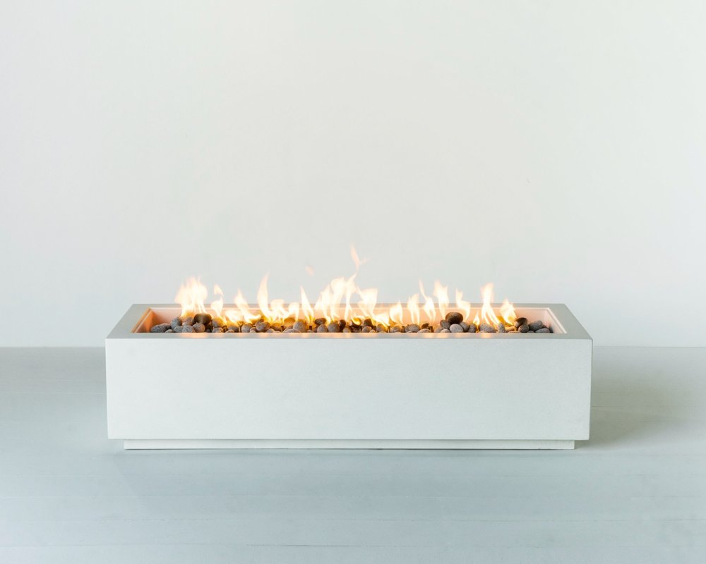 Lumera Aguado rectangular fire pit with fire turned on